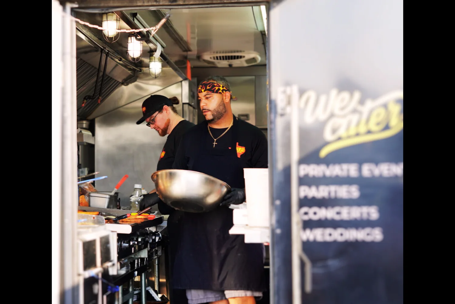 Food service team working inside a food truck
